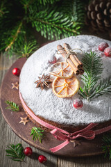 Closeup of poppy seed cake for Christmas decorated with spruce