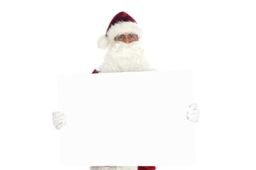 Senior man wearing a traditional Santa Claus costume holding a blank white sign ready for your copy.  Isolated on white.