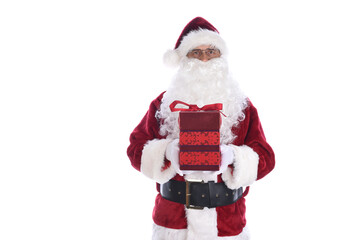 Senior man wearing a traditional Santa Claus costume holding a red gift box with bow.  Isolated on white.