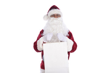 Senior man wearing a traditional Santa Claus costume holding a large gift bag in both hands.  Isolated on white.