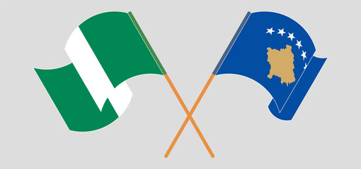 Crossed and waving flags of Nigeria and Kosovo
