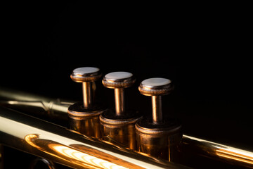 Brass instruments, golden trumpet in the dark

