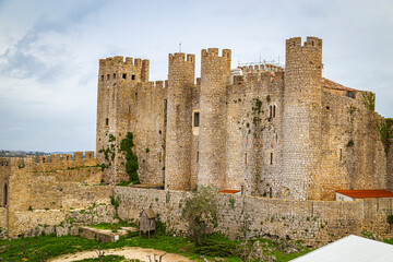 Fototapeta na wymiar Stone castle of Óbidos Medieval castle located in the parish of Santa Maria, São Pedro and Sobral da Lagoa, West, Portugal.