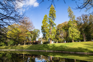 Lake with blue sky and many trees