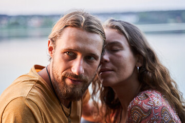 Couple sitting near the water