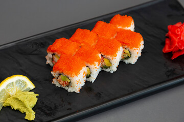 japanese sushi food. Maki ands rolls with tuna, salmon, shrimp, crab and avocado. Top view of assorted sushi. Rainbow sushi roll, uramaki, hosomaki and nigiri. Assorted sushi