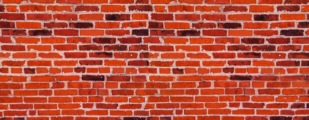 Red Brick wall of clinker bricks masonry - old brick wall of clay brick with cement seams