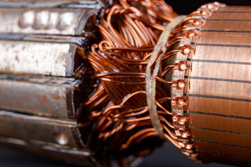 Electric motor rotor on a dark table. Accessories for overhaul and repair of engines.