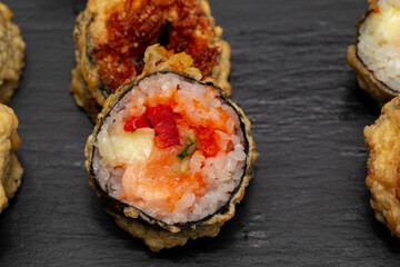 japanese sushi food. Maki ands rolls with tuna, salmon, shrimp, crab and avocado. Top view of assorted sushi. Rainbow sushi roll, uramaki, hosomaki and nigiri. Assorted sushi