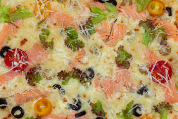 Delicious pizza with cheese and basil on table. op view tasty italian pizza. Four cheese pizza quattro fromaggi with basil leaf.