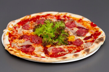 Delicious pizza with cheese, salami and basil on table. Top view tasty italian pizza with cheese and sausage