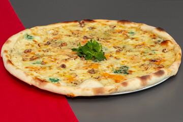 Delicious pizza with cheese and basil on table. op view tasty italian pizza. Four cheese pizza quattro fromaggi with basil leaf.