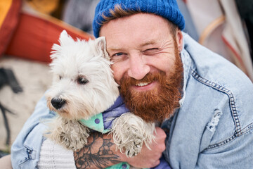 Man taking pictures with his dog