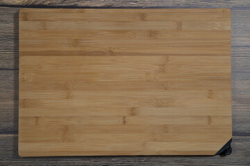 Cutting Board for cooking on a wooden background.