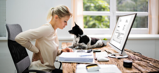 Woman With  Pain Back Sitting In Bad Posture