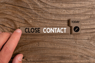 Writing note showing Close Contact. Business concept for having a history of direct exposure to a...