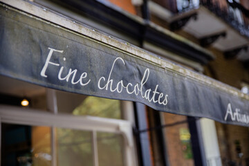 Up-close View of the Dark Blue Business Awning of a Fine Chocolates Shop