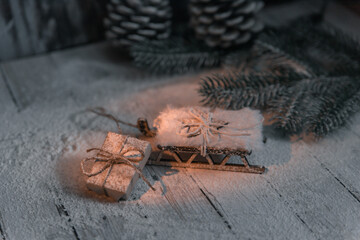 Christmas background with toys, balls, cinnamon, sprigs of Christmas tree and sled. Place for text
