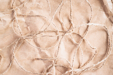 Paper for packing parcels. Thread for dressing parcels and gifts. Crumpled paper and packing string.