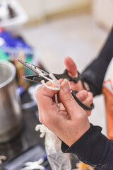 Preparing and trimming the wick of a home made scented aromatherapy candle