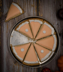 Pumpkin pie cookies on wooden rustic table copy space