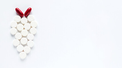 White and Red Pills Isolated on White Background