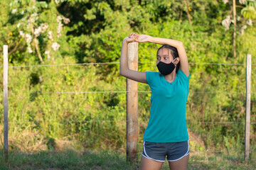 woman doing exercises outdoors
