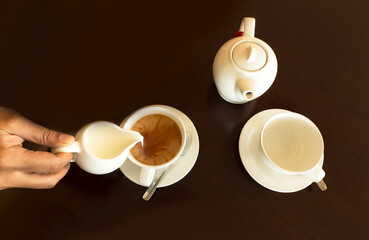 Making a cup of English tea with a dark background