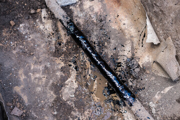 gas pipe in resin. Resin-treated pipe treated with resin.