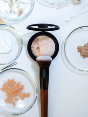 Eco-friendly and useful decorative cosmetics, concept. Powder and various ingredients in bottles