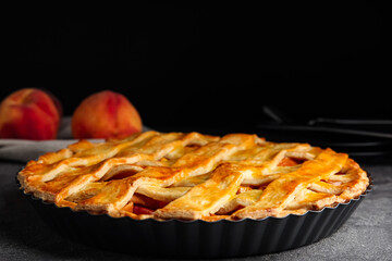 Delicious fresh peach pie on grey table, closeup