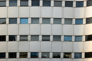 Modern office building windows, some windows displaying  Je Suis Charlie ( I am Charlie ) peace protest posters , Paris France
