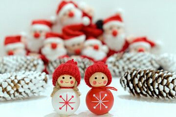 funny toys close up on a blurred background of santa claus toys and fir cones