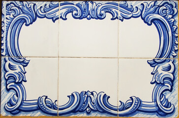 blue tiles of portuguese plaque in wall - obrazy, fototapety, plakaty