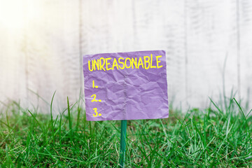 Conceptual hand writing showing Unreasonable. Concept meaning not conformable to reason or...