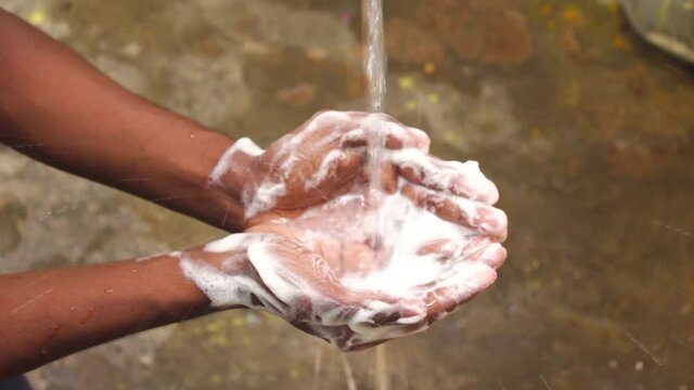 Washing Hands Slow Motion .Man Washing His Hands In The Garden At Home. Coronavirus Pandemic Prevention Wash Hands With Soap Warm Water And , Rubbing Nails . Hygiene & Cleaning Hands.