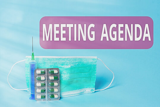 Writing note showing Meeting Agenda. Business concept for items that participants hope to accomplish at a meeting Primary medical precautionary equipments for health care protection - Powered by Adobe
