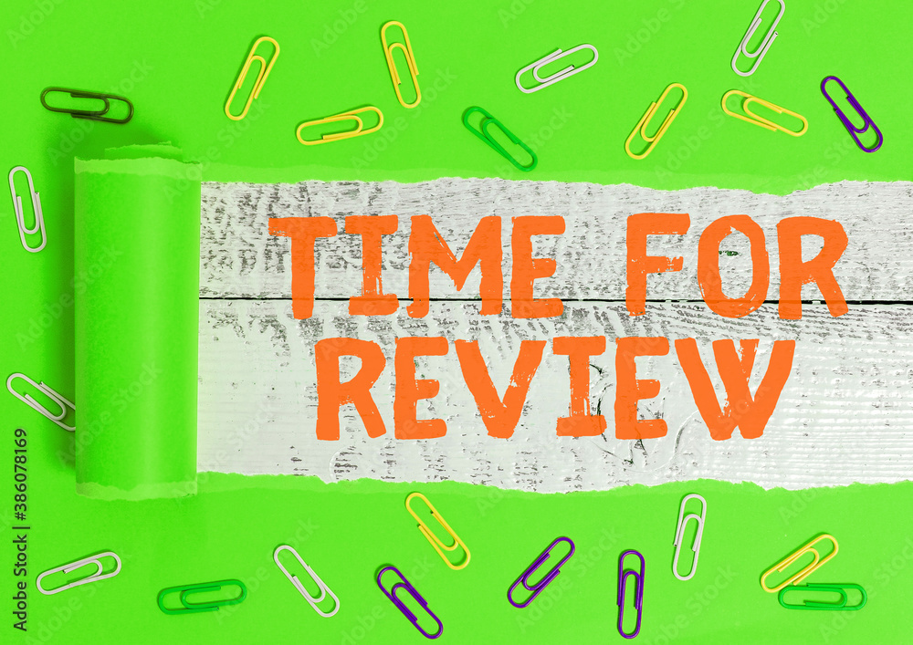 Wall mural writing note showing time for review. business concept for review of a system or situation in its fo