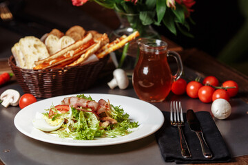 Light salad with vegetables bacon cherry grilled mushrooms tomatoes egg. delicious summer lunch