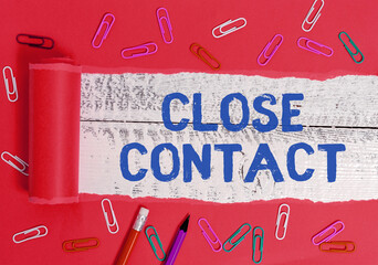 Writing note showing Close Contact. Business concept for having a history of direct exposure to a...