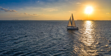 sailing in ocean during sunset
