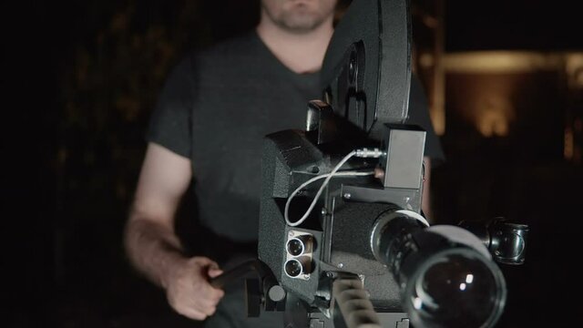 man or director using a film camera. CP16 vintage 16mm film camera