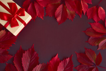 Fototapeta na wymiar Christmas box with red ribbon