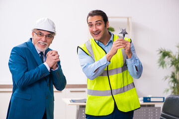 Two male architects working in the office