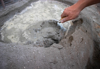 Manual mixed cement with sand, gravel and water by shovel