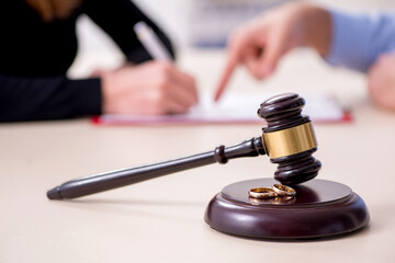 Young pair in courthouse in divorcing concept