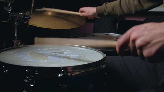  Jazz drummer hands playing at drums. Close up shot. Home lesson training.