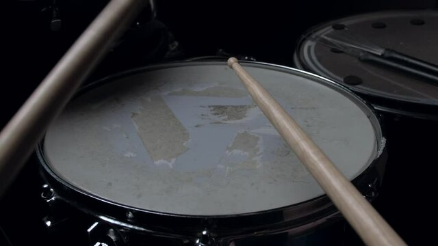 pov - the drummer plays with sticks on a snare drum, home lesson paradiddle training