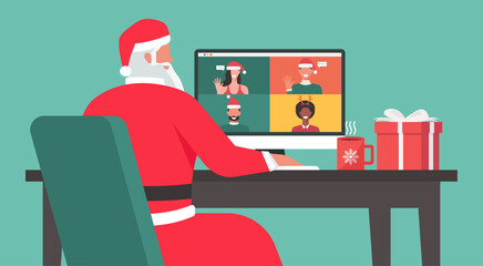 Santa Claus sitting at the desk and using a laptop video calling to people at his office on the Christmas holiday, vector flat illustration - obrazy, fototapety, plakaty