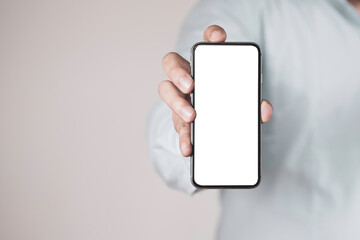 Businessman holding smartphone  for add text wording or message or mockup advertisement with copy space.